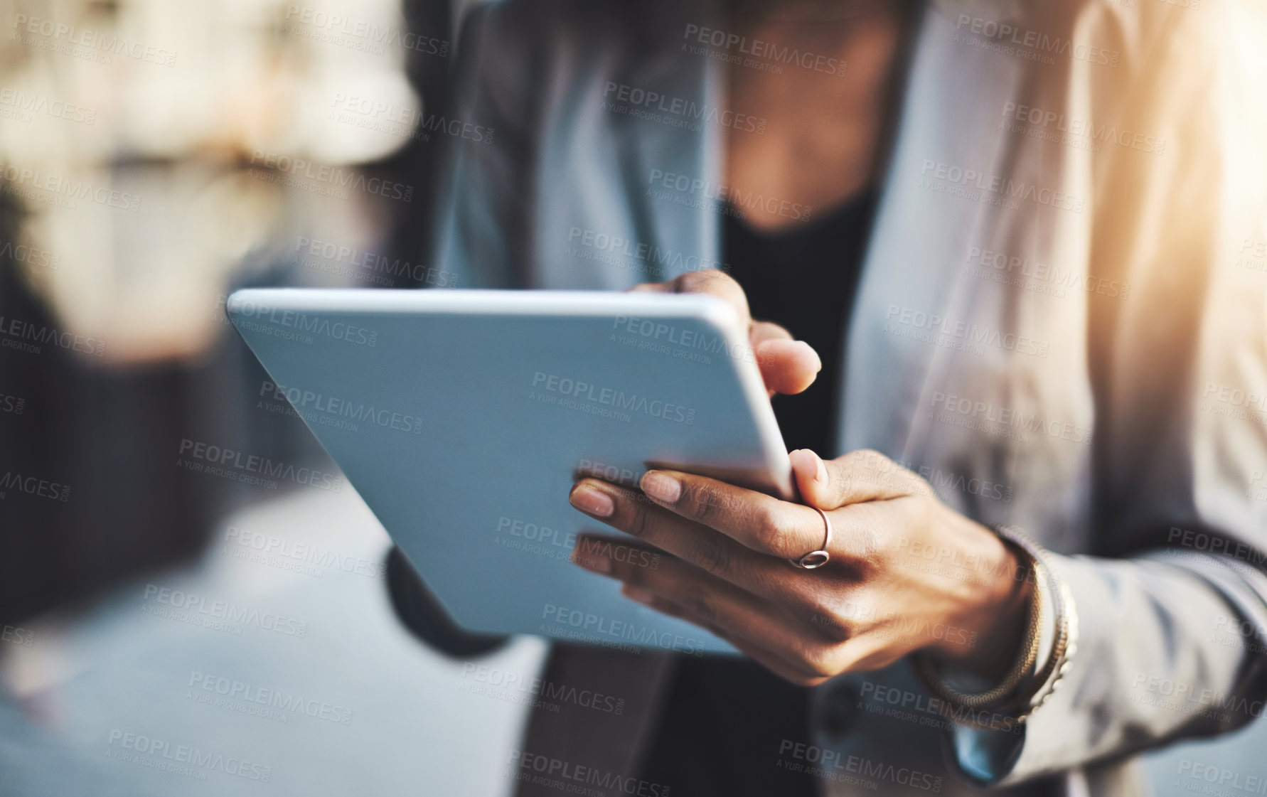 Buy stock photo Closeup shot of a businesswoman using a digital tablet in the city