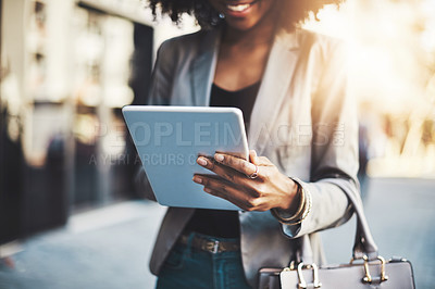 Buy stock photo Closeup shot of a businesswoman using a digital tablet in the city