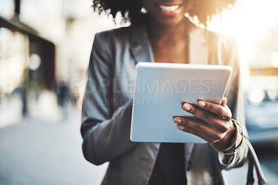 Buy stock photo Walking, tablet and hand of businesswoman in city for travel, social media or networking on sidewalk. Lens flare, outdoor and black person for morning commute, review or check schedule in town