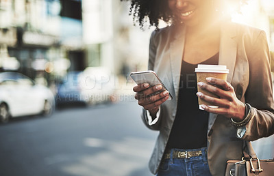 Buy stock photo Closeup shot of a businesswoman using a cellphone in the city