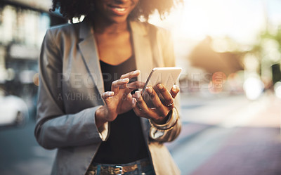 Buy stock photo Business woman, hands and phone in city for social media, communication or texting outdoors. Hand of female employee chatting online, email or mobile smartphone app or networking in urban town street