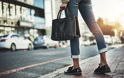 Buy stock photo Closeup shot of a businesswoman walking with her handbag in the city