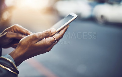Buy stock photo Woman, hands and phone in city for social media, communication or texting on street sidewalk outdoors. Hand of female chatting on mobile smartphone for networking, online browsing or travel in town