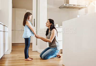 Buy stock photo Shot of an adorable little girl spending time with her mother at home