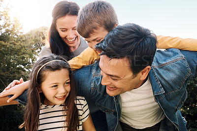 Buy stock photo Shot of a happy family of four having fun outdoors