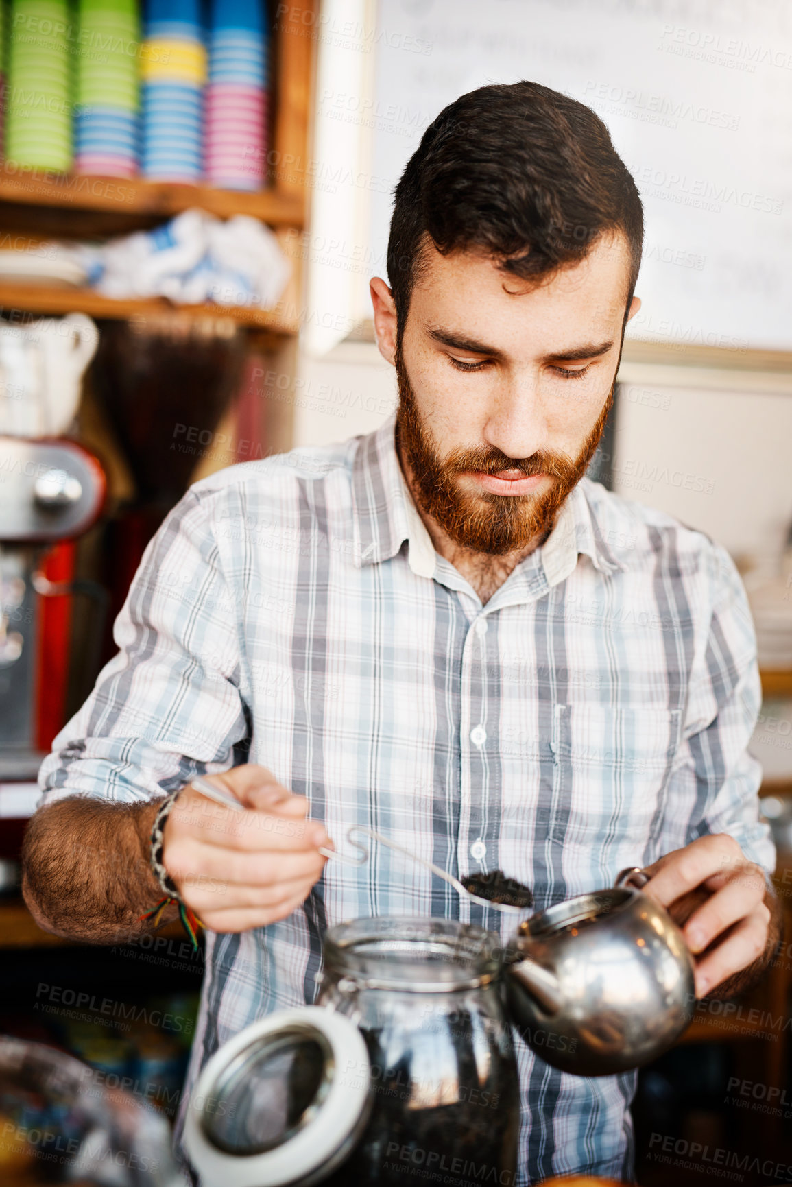 Buy stock photo Tea, herbs and man in cafe with pot for natural drink, wellness or calm process at small business. Relax, hospitality or person in restaurant with healthy brew of leaves in teapot for morning service