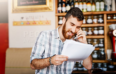 Buy stock photo Man, phone call and shop owner in restaurant with paperwork, thinking or negotiation for price, smile and deal. Barista, smartphone and documents for invoice, inventory and contact supplier in cafe