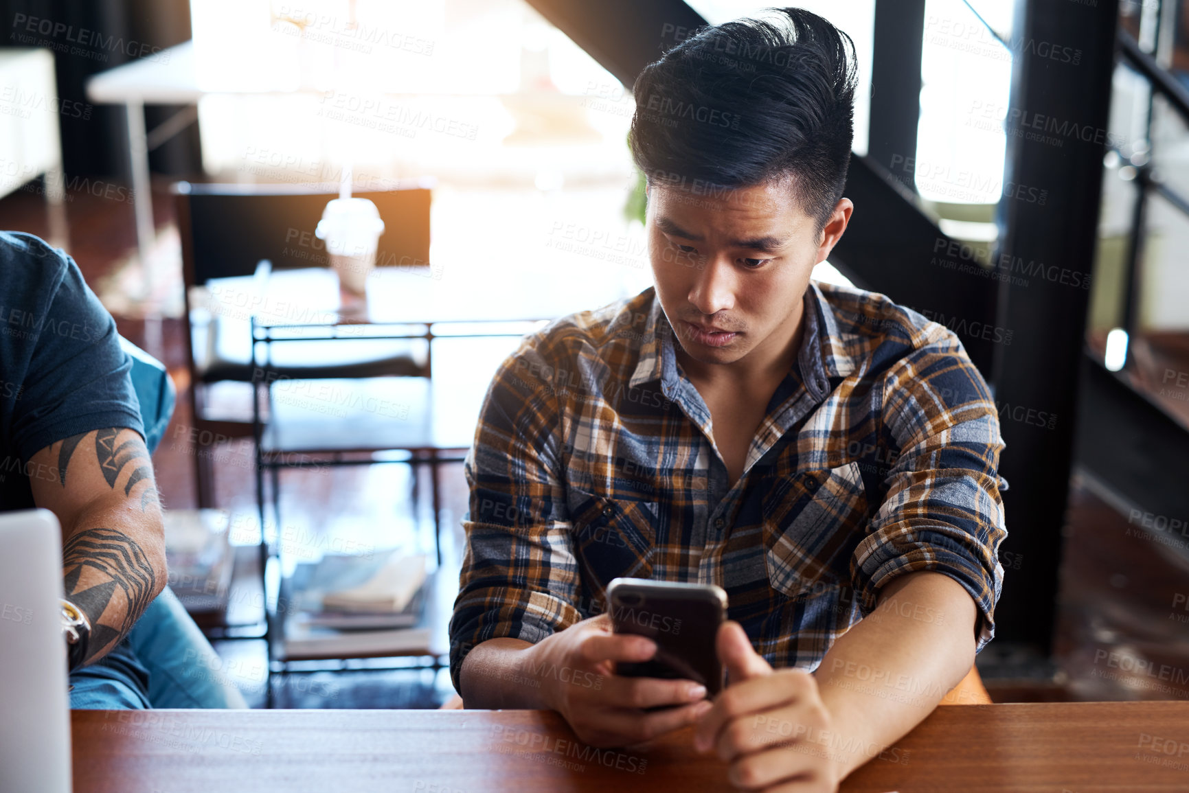 Buy stock photo Asian man, phone and office for reading news, online communication and networking journalist. Male person, notification and app for client chat or website for information, article planning and typing