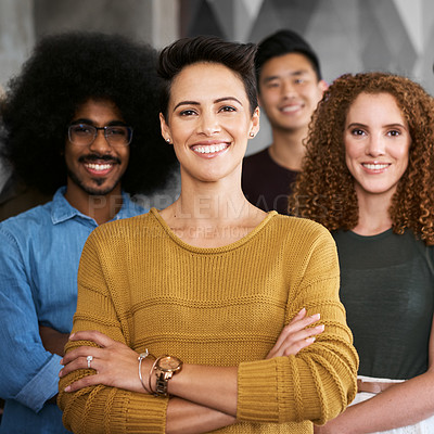 Buy stock photo Cropped portrait of a group of designers standing with their arms folded in a creative office