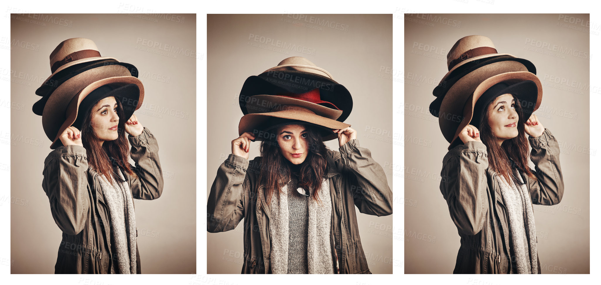 Buy stock photo Composite shot of a young woman wearing a pile of hats against a brown background