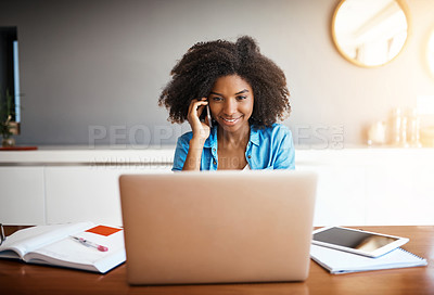 Buy stock photo Shot of an attractive young woman taking a phone call while working on her laptop at home