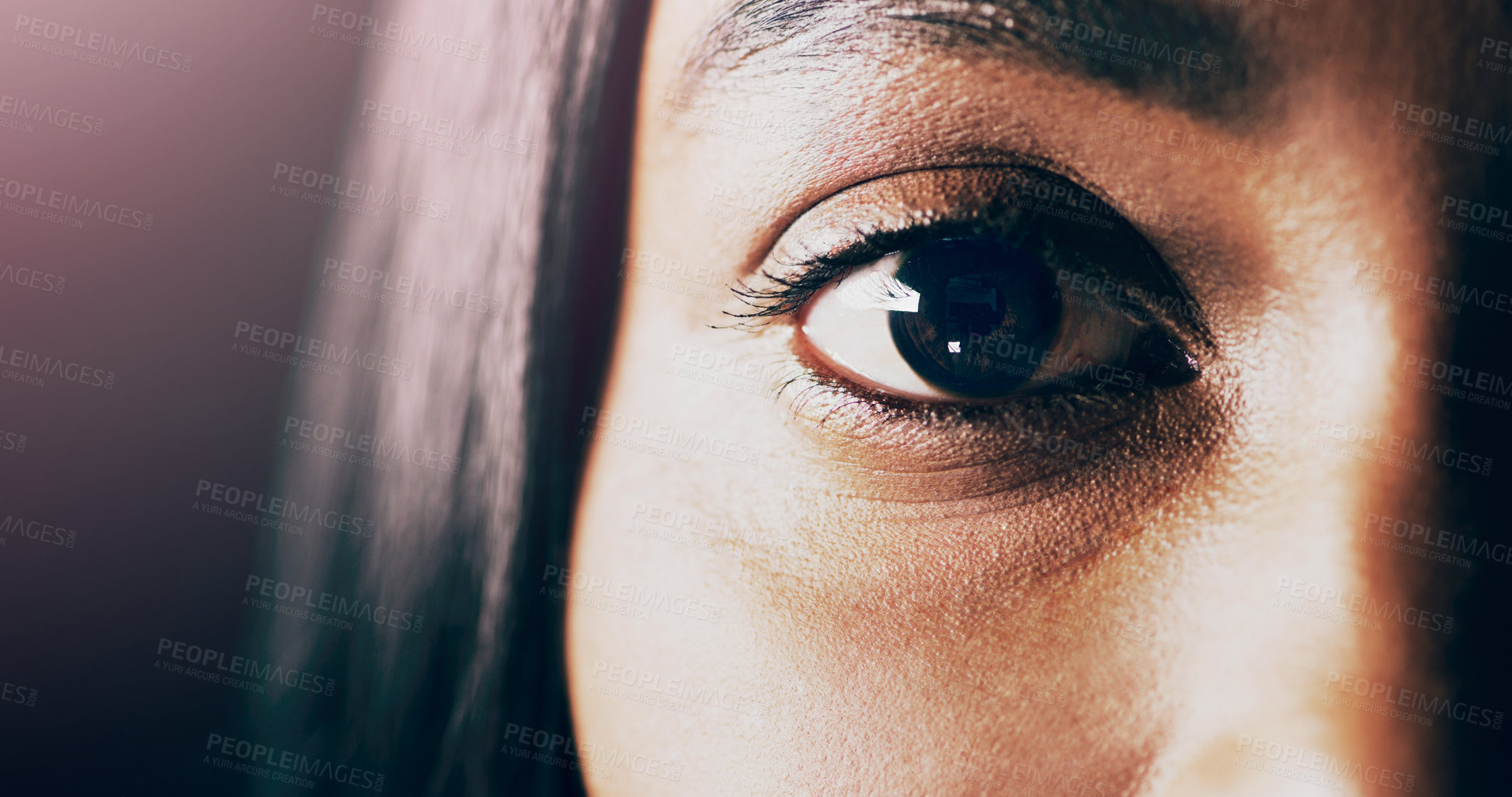 Buy stock photo Closeup shot of a beautiful young woman's eye against a dark background