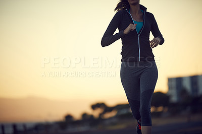Buy stock photo Closeup shot of a sporty woman exercising outdoors