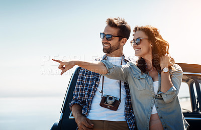 Buy stock photo Cropped shot of an affectionate couple taking in the sights while enjoying a road trip