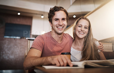 Buy stock photo Cropped portrait of a happy young student couple studying together at a cafe
