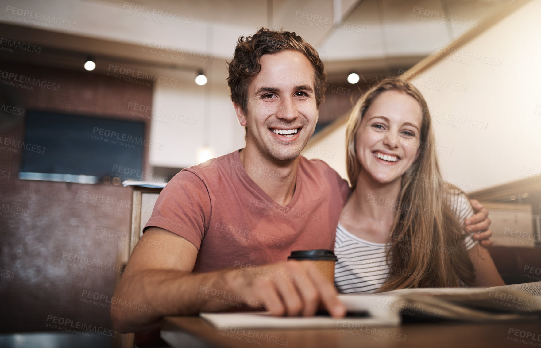 Buy stock photo Cropped portrait of a happy young student couple studying together at a cafe