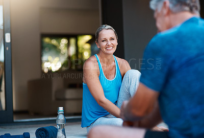 Buy stock photo Shot of a mature and happy couple taking a break after an intense workout session outside of their home