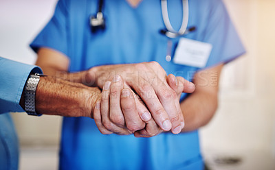 Buy stock photo Care, support and a doctor holding hands with a man for healthcare, help and service. Caregiver, love and closeup of a nurse with a helping hand for a senior person for medical trust and nursing