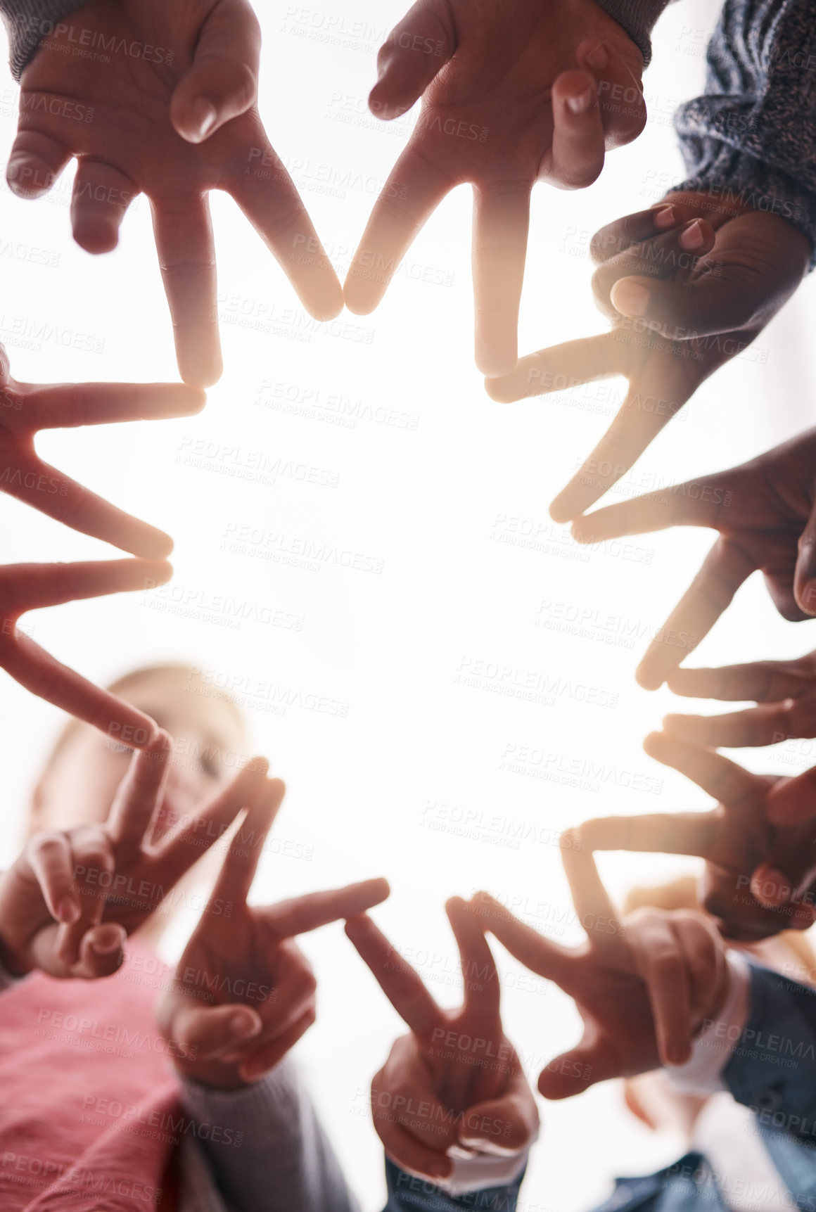 Buy stock photo Star, gesture and hands of people with teamwork for community, support and collaboration. Low angle, fingers and group of children with peace for friendship, development and connection in solidarity