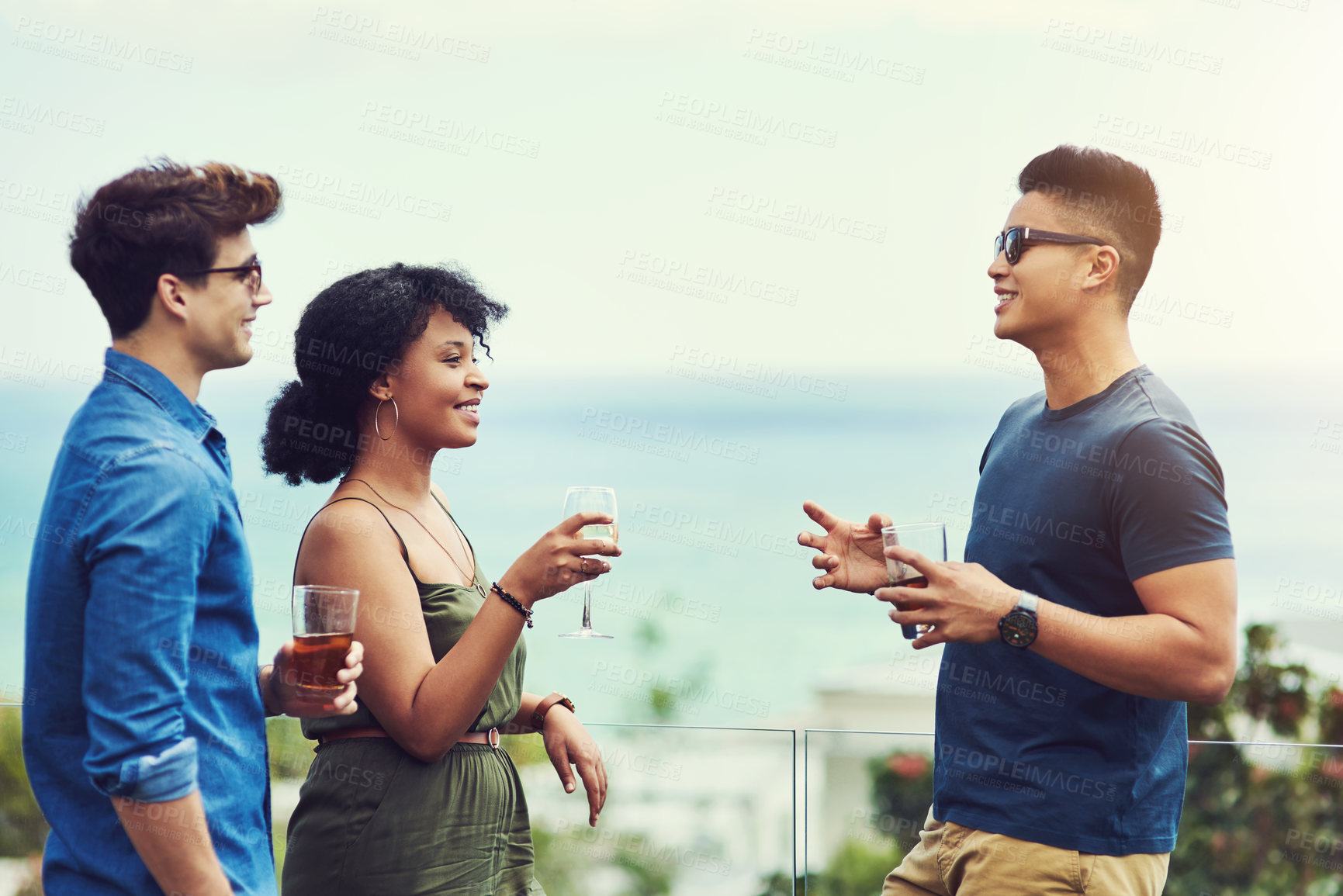 Buy stock photo People, friends and talking with alcohol on rooftop for celebration, summer holiday and bonding in nature. Group, happy and reunion with drinks, vacation and weekend trip on balcony with conversation