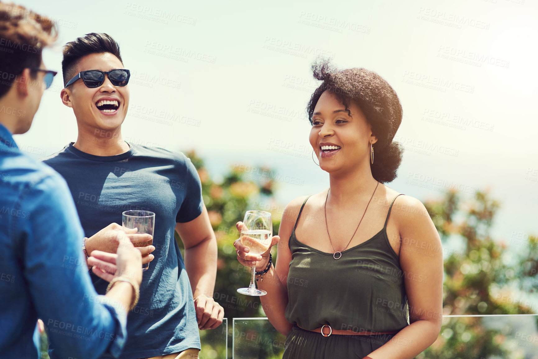 Buy stock photo People, friends and laughing with alcohol on rooftop for celebration, summer holiday and comic bonding in nature. Group, talking and reunion with drinks, vacation or weekend fun on balcony with smile