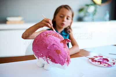 Buy stock photo Shot of an adorable little girl working on her art project at home