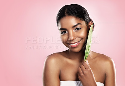 Buy stock photo Portrait, happy woman and leaf for skincare in studio, pink background and mockup of vegan dermatology. Face, african model and leaves for eco friendly beauty, natural glow or cosmetic sustainability