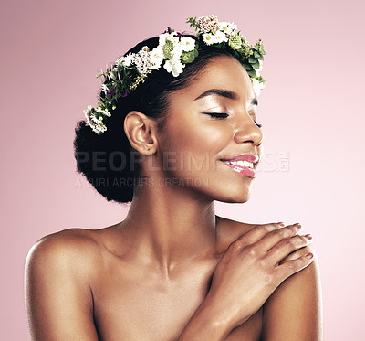 Buy stock photo Happy woman, crown of flowers and makeup in studio, pink background and natural skincare aesthetic. African face, female model and floral headband for beauty, sustainable cosmetics and spring fashion