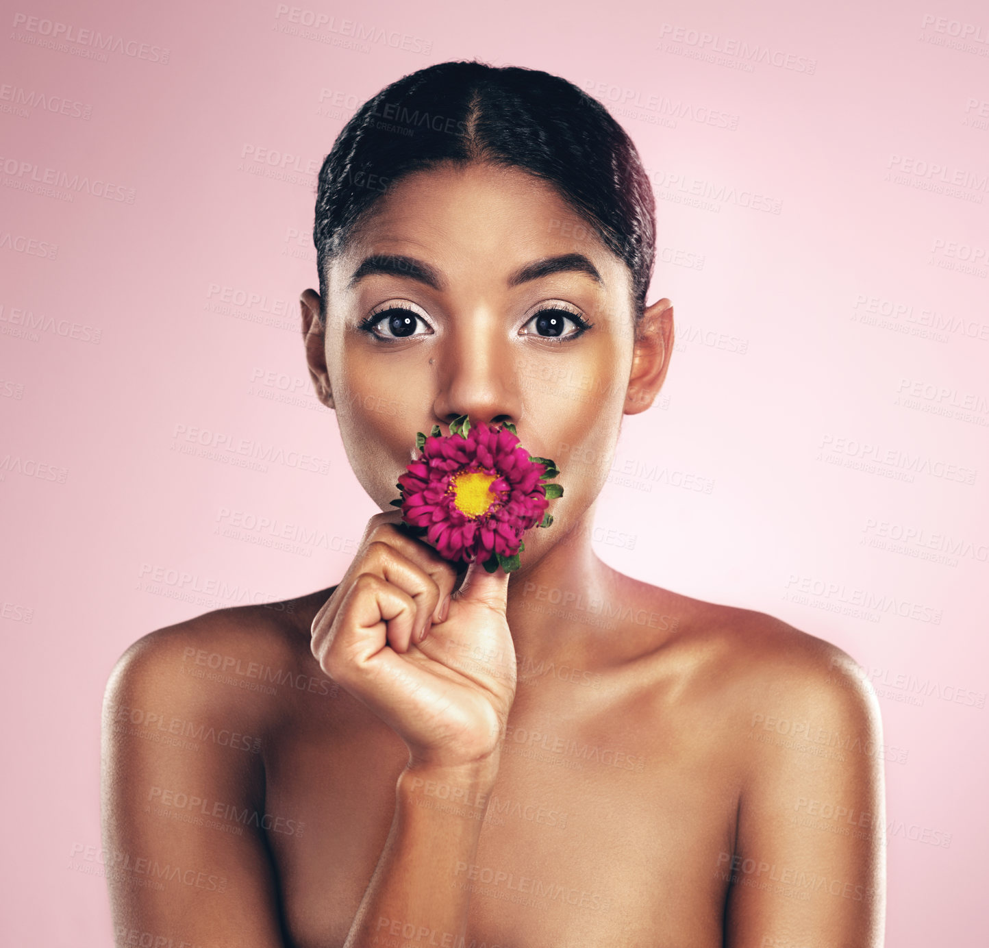 Buy stock photo Woman, flower and portrait in studio for wellness with makeup on pink background for aesthetic or visual impact. Springtime, plant and eye with beauty, floral and blossom with clear skin with glow