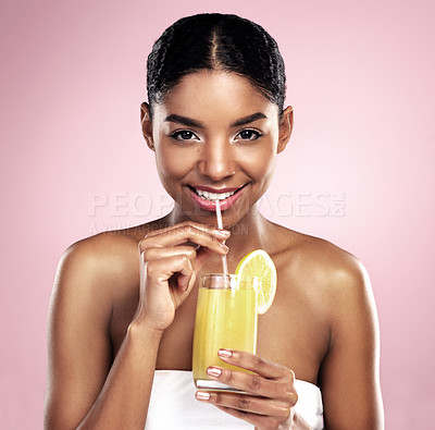 Buy stock photo Portrait, woman and orange juice in studio for beauty, healthy nutrition or vitamin c benefits on pink background. Happy african model, glass and fruit cocktail drink, citrus smoothie or natural diet