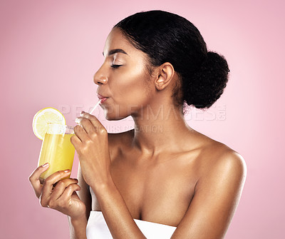 Buy stock photo Woman, orange juice drink and glass in studio, pink background or detox for healthy weight loss. African model, citrus smoothie and vitamin c fruits for nutrition benefits, natural beauty or wellness