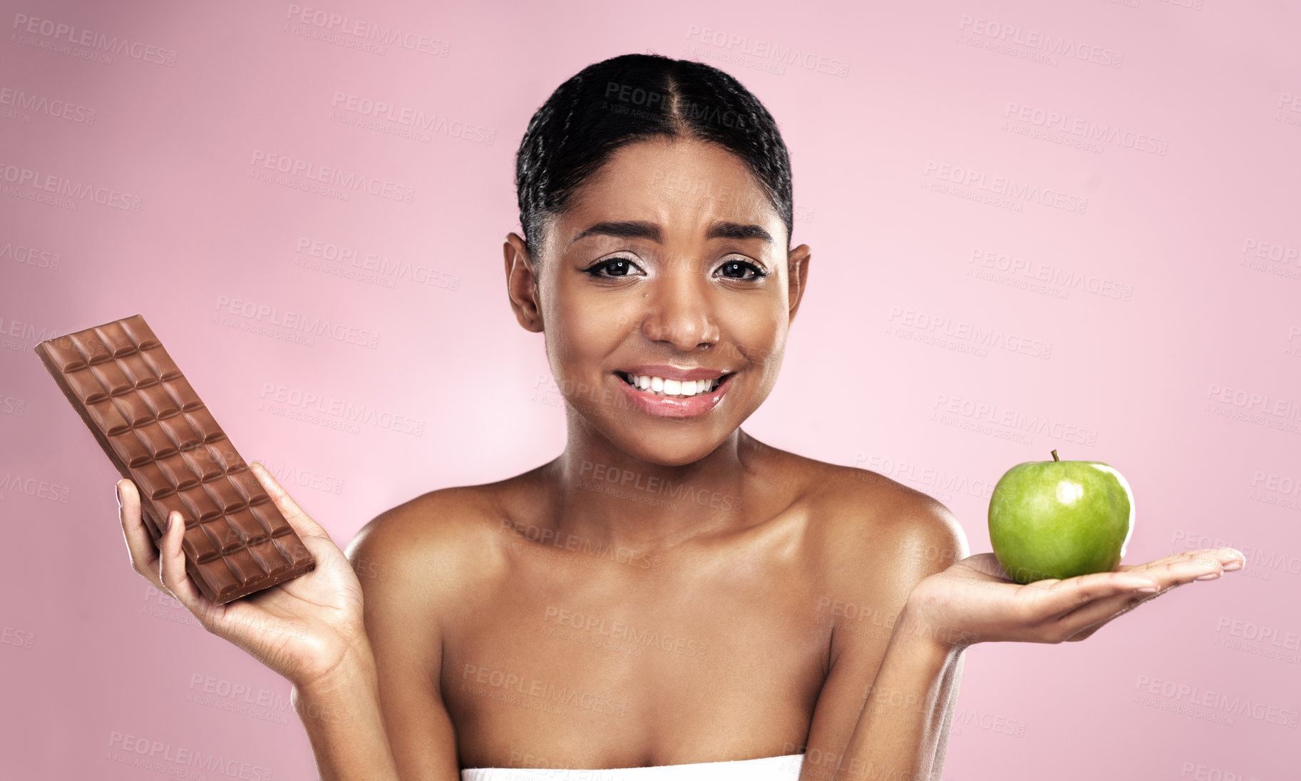 Buy stock photo Black woman, health and nutrition with food choice for weight loss journey isolated on pink background. Happy, female person or model and fruit or chocolate decision for wellness and fitness goal