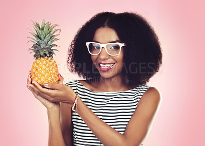 Buy stock photo Portrait, black woman and pineapple with fashion, studio and smile on pink background. Eyewear, fruit and summer clothing aesthetic for female model, natural and ethical or sustainable clothing style