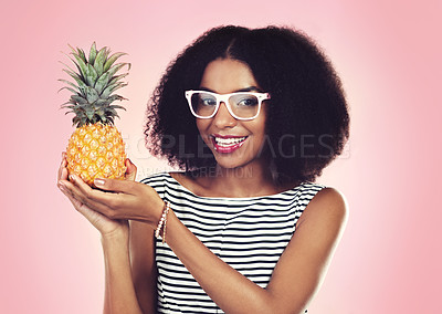 Buy stock photo Portrait, black woman and pineapple with fashion, studio and smile on pink background. Eyewear, fruit and summer organic aesthetic for female model, natural and ethical or sustainable clothing style