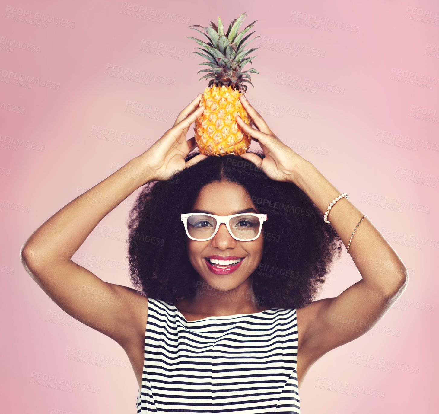 Buy stock photo Portrait, black woman and pineapple with fashion, studio and head on pink background. Glasses, fruit and summer clothing aesthetic for female model, natural and ethical or sustainable tropical style