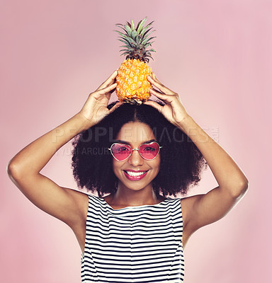 Buy stock photo Studio, portrait and black woman with pineapple, diet and detox on pink background. Eyewear, nutrition and gut digestion for weight loss and vitamins for female model, vegan and vitamin c for fiber