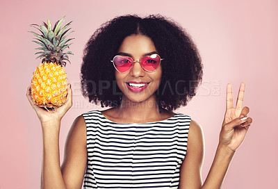 Buy stock photo Peace sign, portrait and black woman with pineapple, studio or detox on pink background. Health, nutrition and gut digestion for weight loss and vitamins for female model, vegan and vitamin for fiber