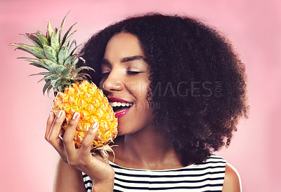 Buy stock photo Girl, pineapple and fruit for nutrition in studio with pink background for gut health, wellness and diet. Female person, immune system and digestion for food as snack with organic, vegan and meal