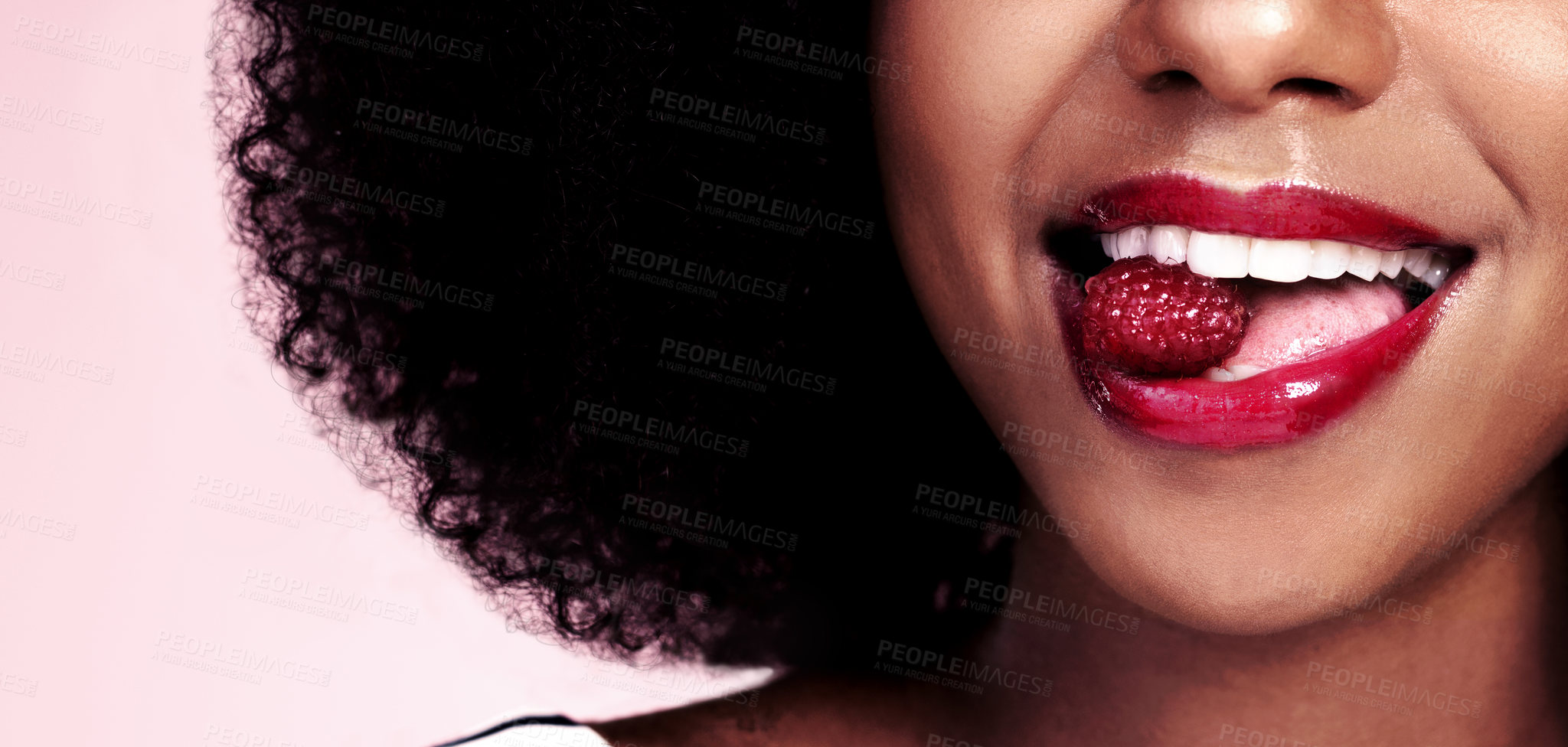 Buy stock photo Eating, teeth and black woman with raspberry for nutrition, health and healthy diet isolated on pink background. Closeup, gen z girl with fruit for food, wellness and happy on studio banner