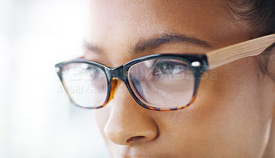 Buy stock photo Closeup shot of an attractive young businesswoman wearing spectacles in a modern office