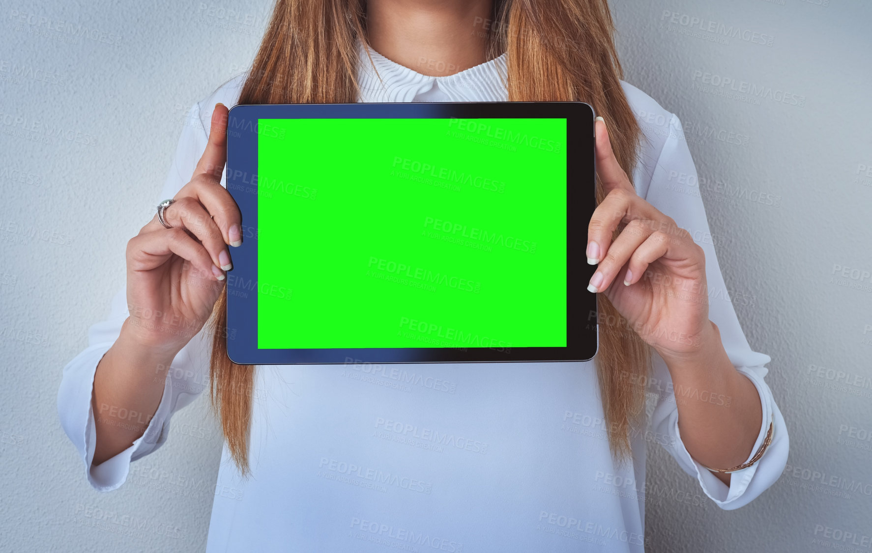 Buy stock photo Green screen, hands and tablet with woman in studio on gray background for digital marketing. Advertising, mockup space and social media on display for announcement, information or online promotion