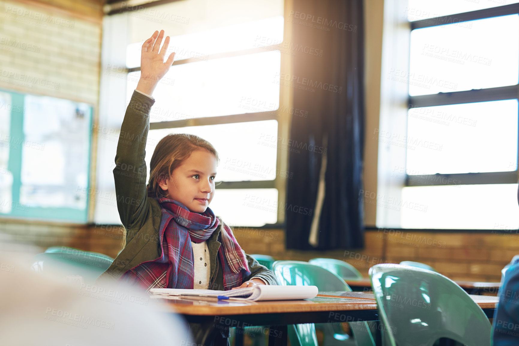 Buy stock photo Girl, child and hand raised in classroom for education, question or thinking with solution for quiz at school. Kid, learning and scholarship with books, development or progress with answer at academy