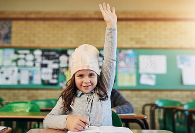 Buy stock photo Girl, child and raised hand in classroom, portrait and happy with writing, notebook and education. Kid, smile and volunteer for answer, question or solution with learning for scholarship in Australia