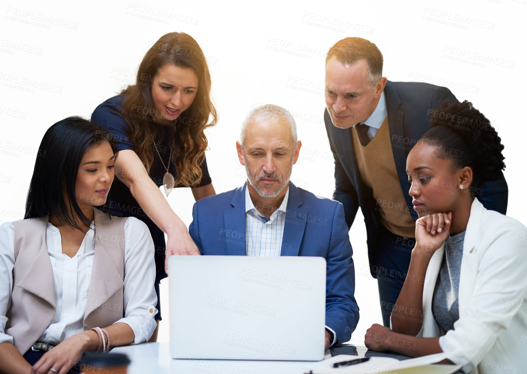 Buy stock photo Cropped shot of a diverse group of businesspeople having a discussion while using a laptop in a modern office