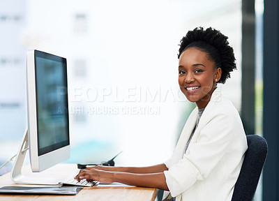 Buy stock photo Cropped portrait of an attractive young businesswoman smiling while working on a computer in a modern office