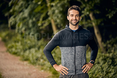 Buy stock photo Portrait of a sporty middle-aged man standing with his hands on his hips