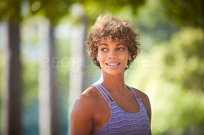 Buy stock photo Cropped shot of a sporty young woman standing outdoors