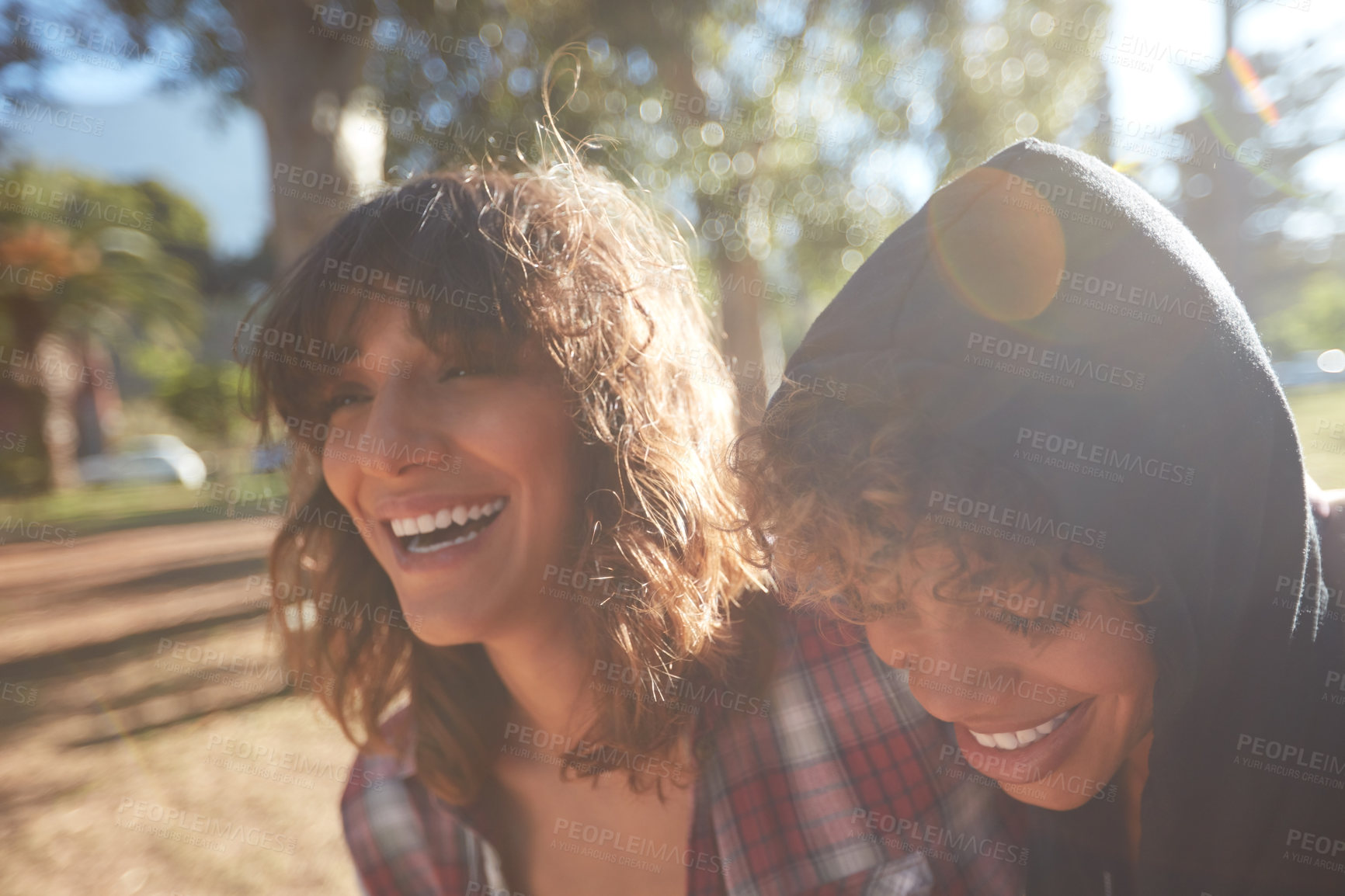 Buy stock photo Cropped shot of a young couple spending the day outdoors on a sunny day