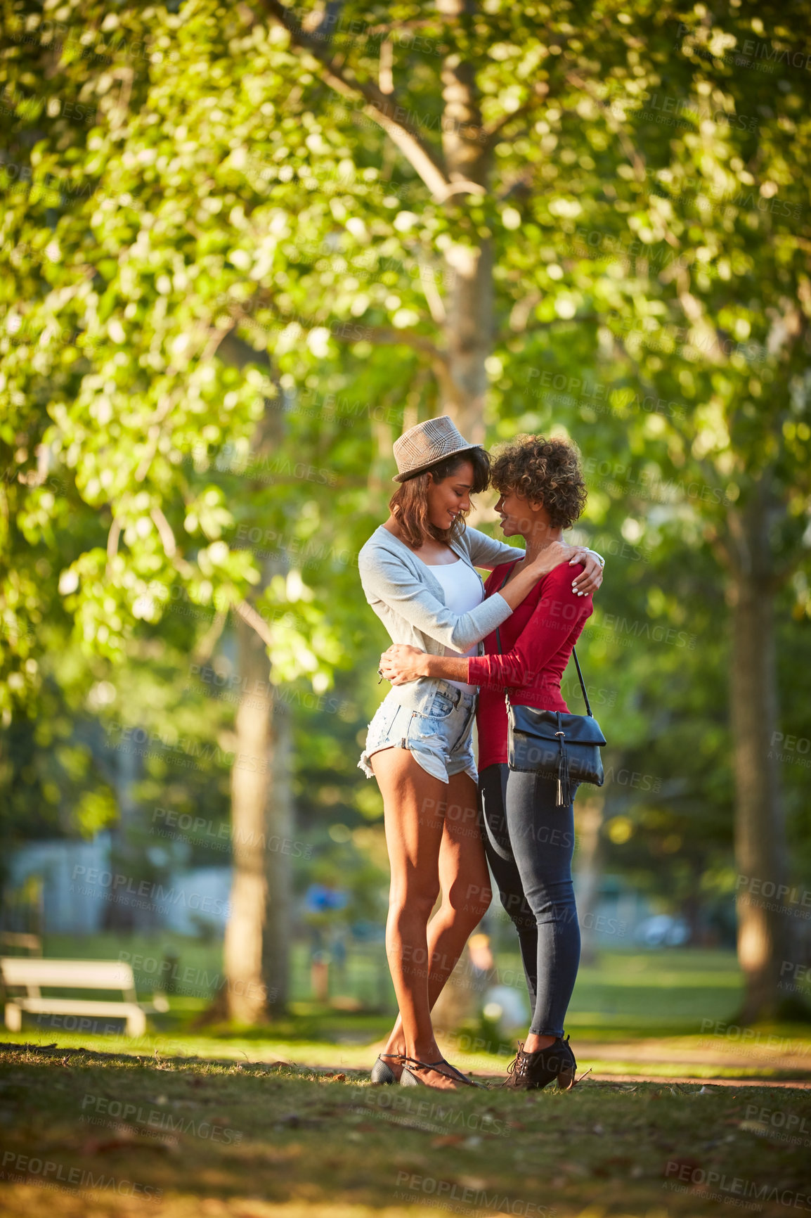 Buy stock photo Shot of a young couple spending the day outdoors on a sunny day