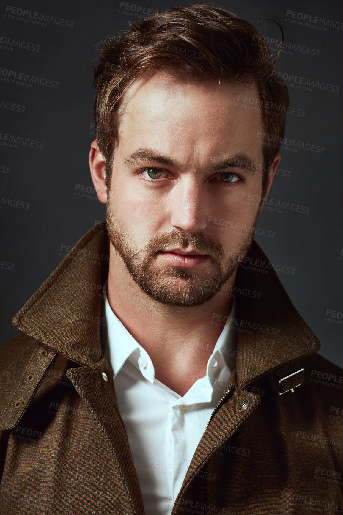 Buy stock photo Fashion, jacket and man with portrait in studio for edgy style, confidence or satisfaction. Designer clothes, serious and person with collar on black background for cool, trendy outfit and pride